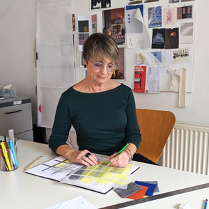 Alison White Designing at her desk